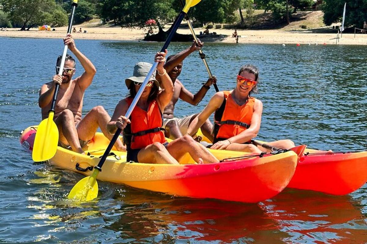 a group of people in a kayak on the water