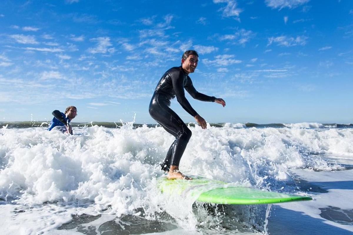 a man riding a wave on a surfboard in the ocean