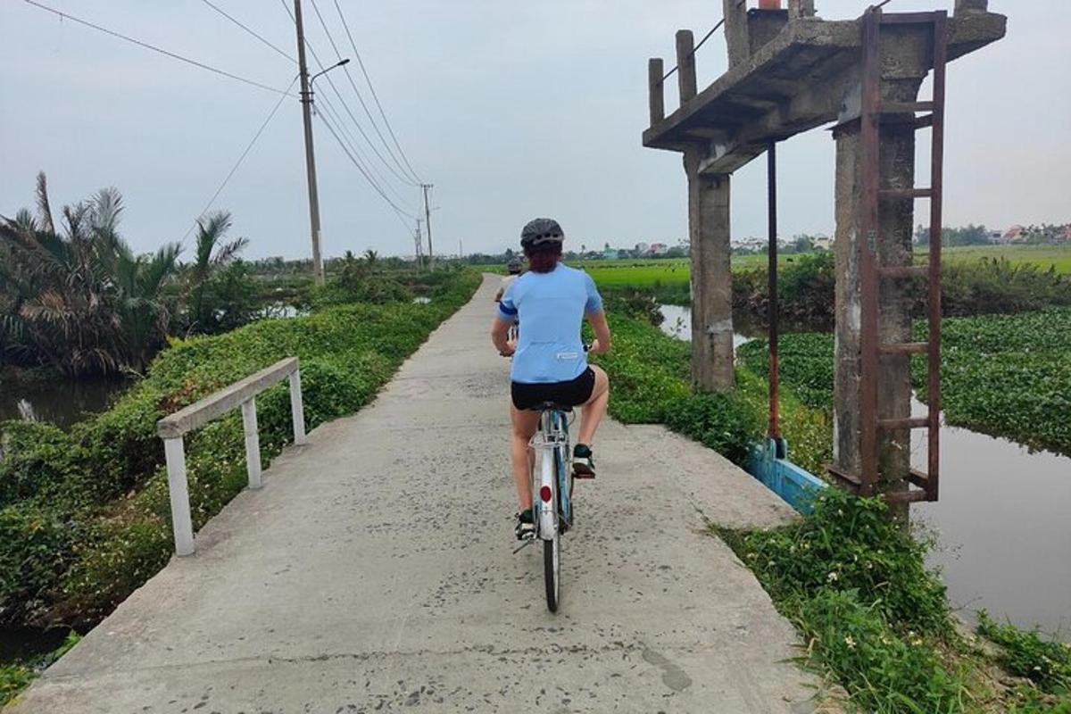 a man riding a bike down a path