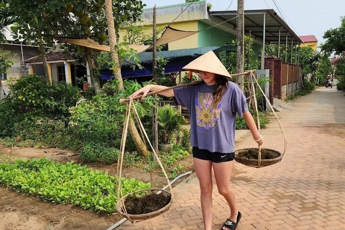 a woman wearing a straw hat holding two baskets