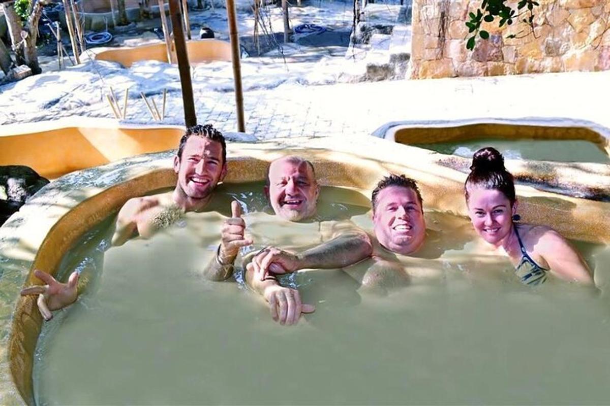 a group of people swimming in a hot tub