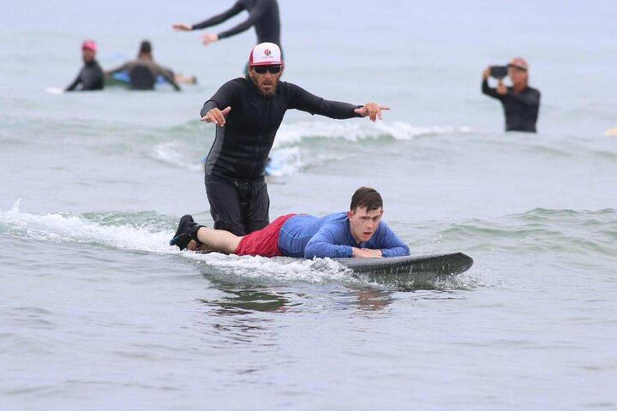 a man is on a surfboard in the water