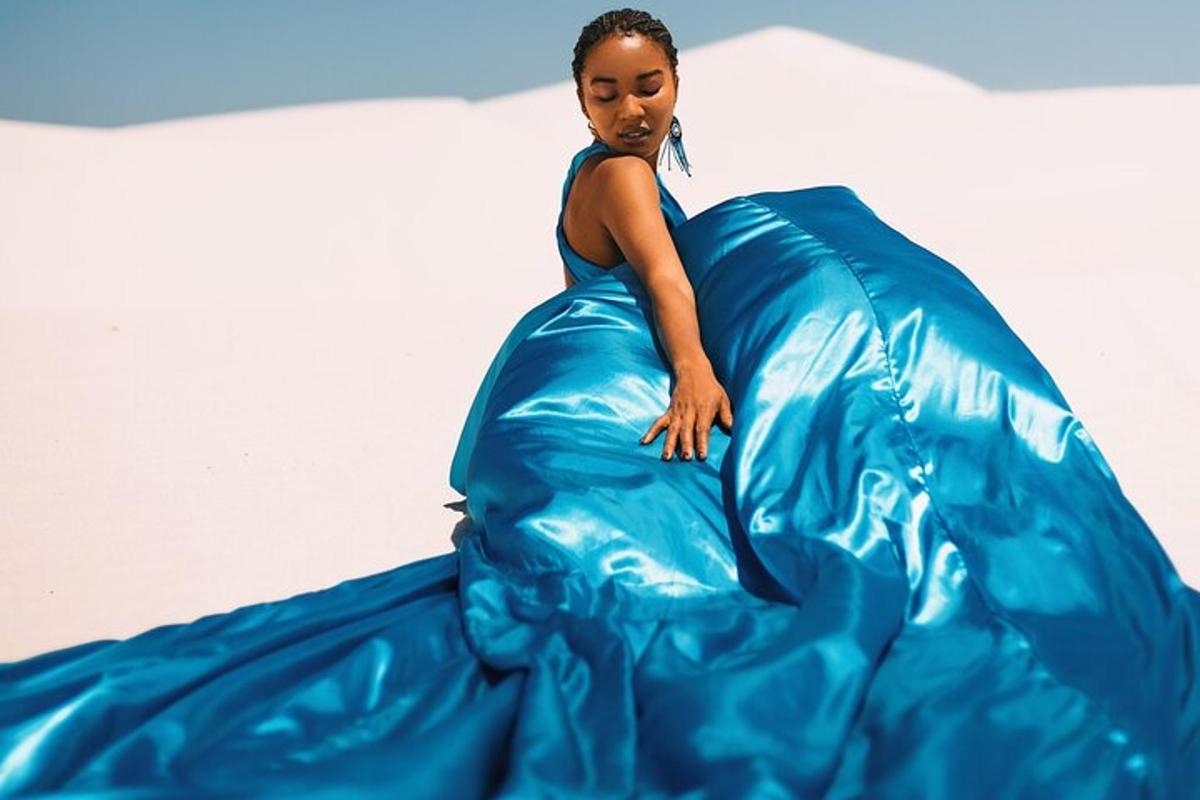 a woman is riding in a blue inflatable