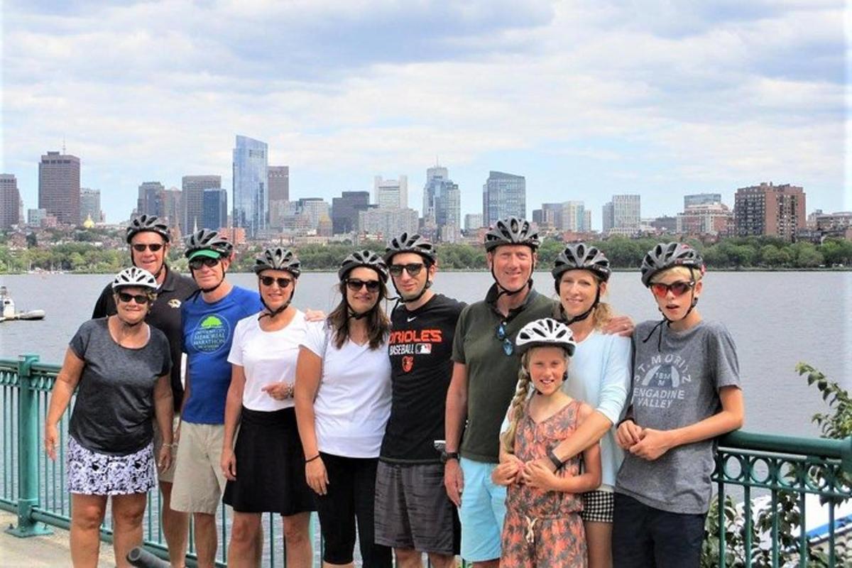 a group of people wearing bike helmets posing for a picture