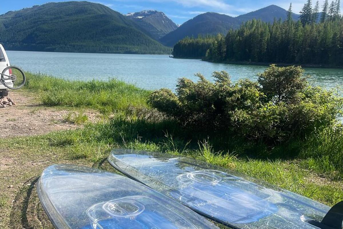 a glass table on the side of a body of water