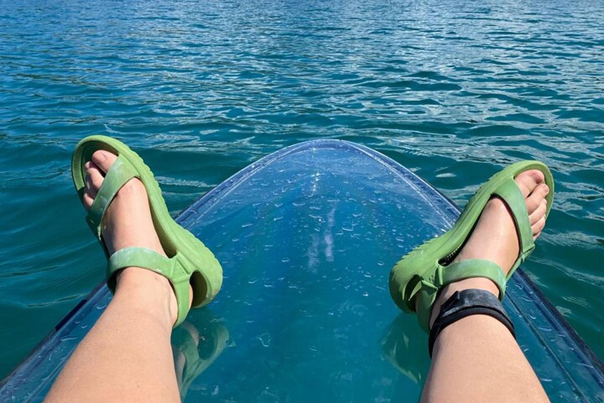 a person with their feet up on a boat in the water