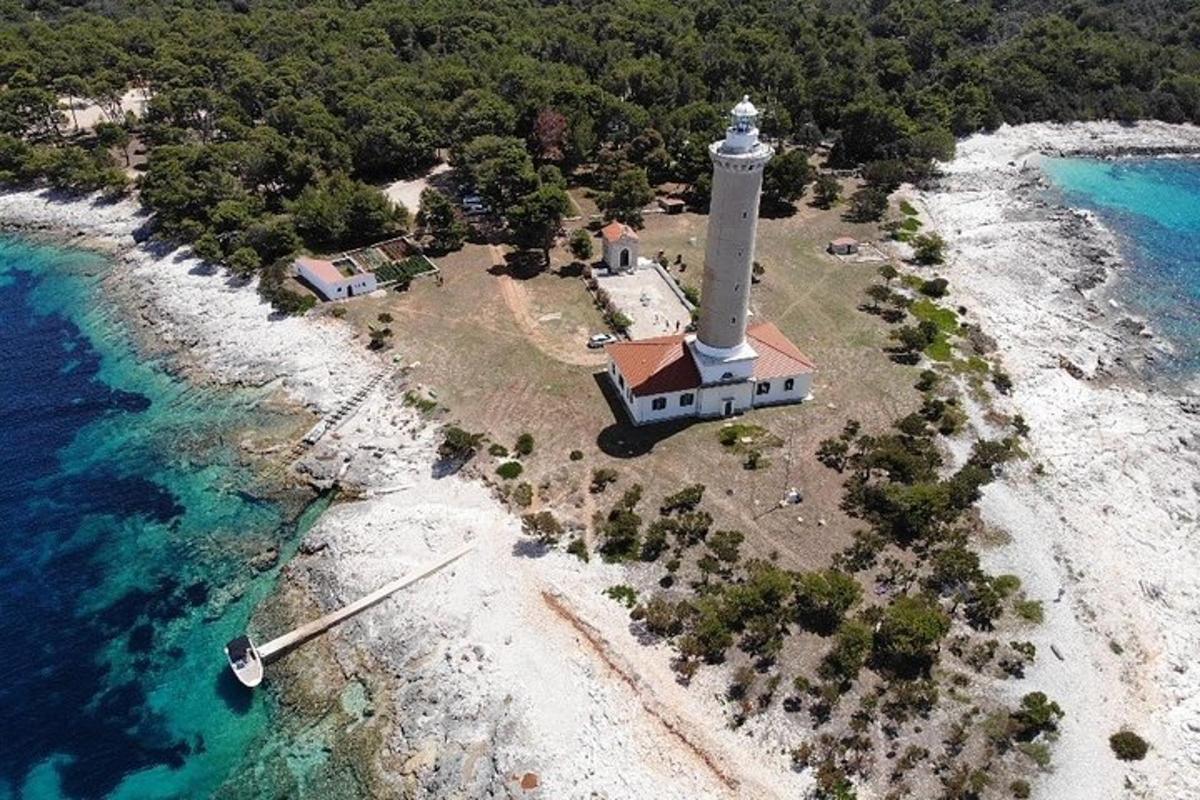 an aerial view of a lighthouse on an island