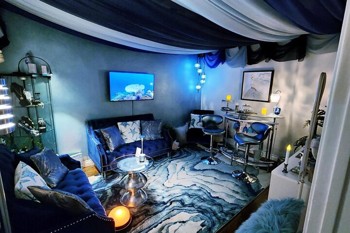 a blue living room with a couch and a table