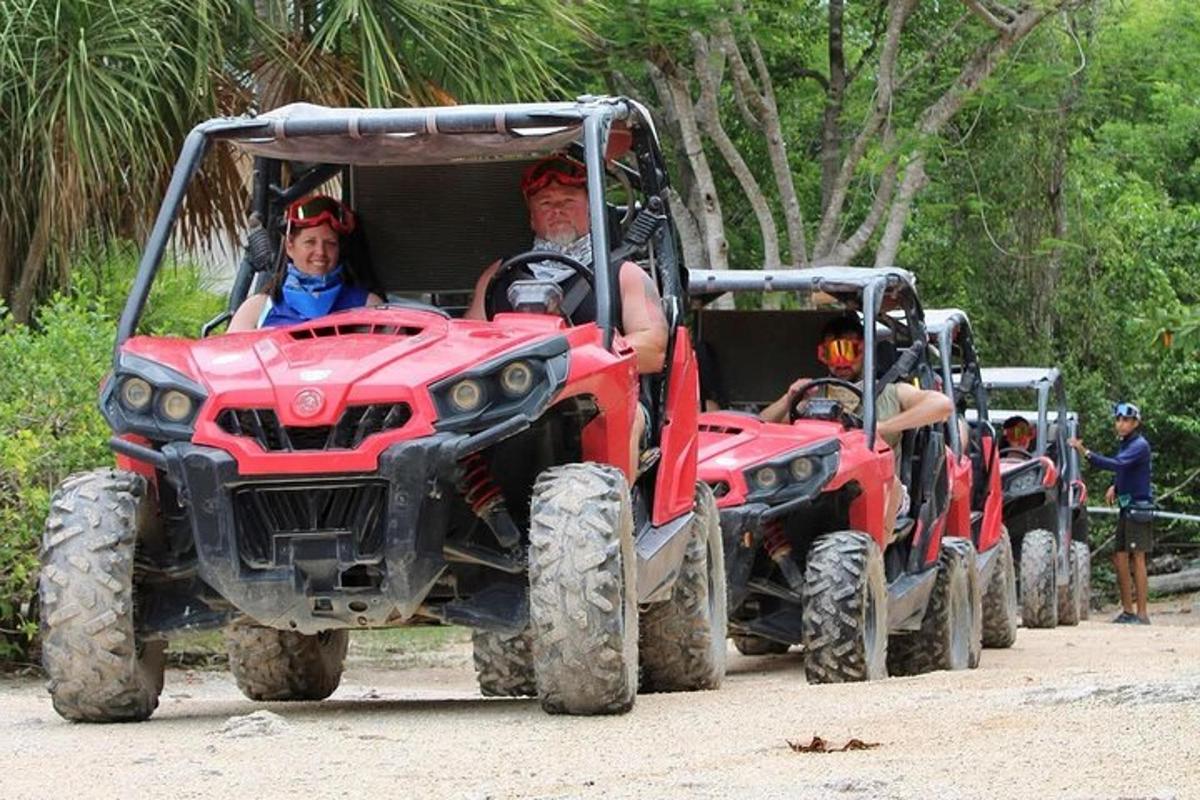 a group of people riding on a four wheeler