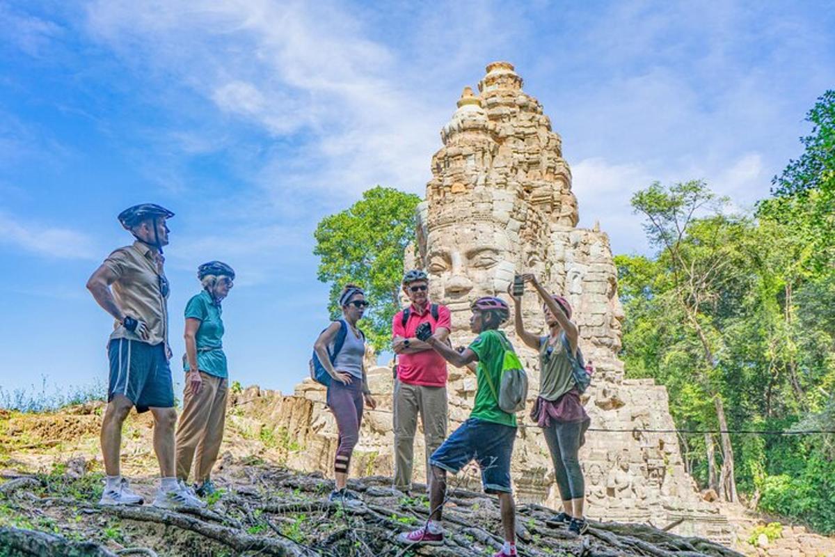 a group of people standing in front of a statue