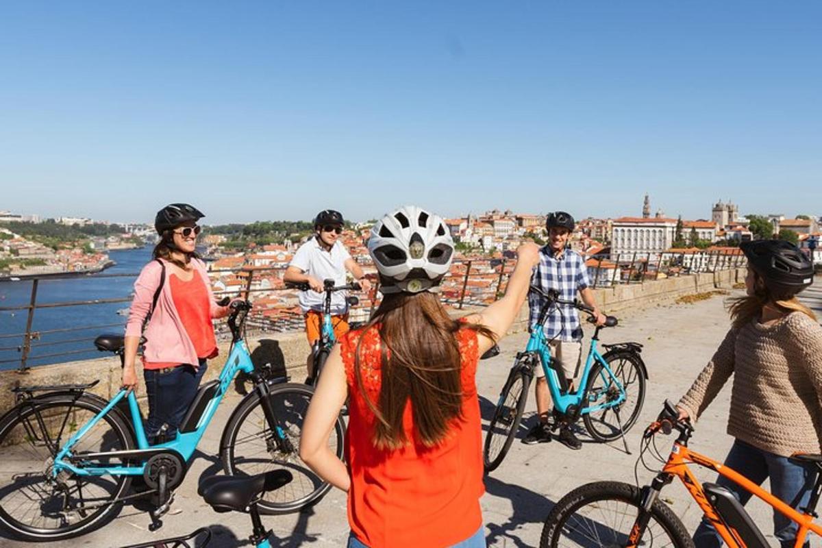 a group of people with bikes on a bridge