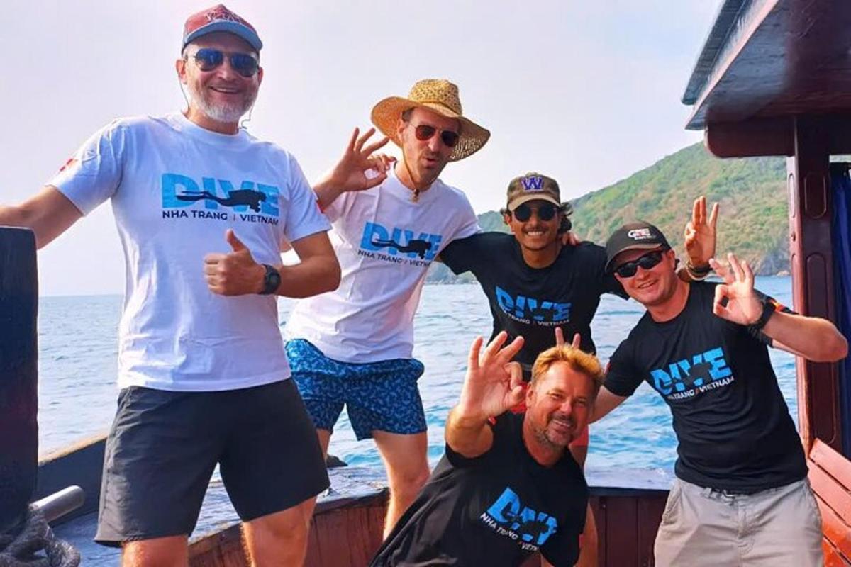 a group of men posing for a picture on a boat