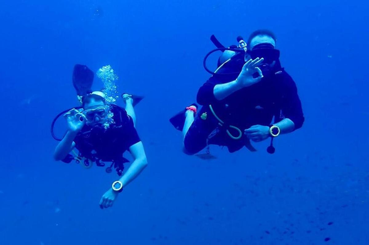 a group of people taking pictures in the water