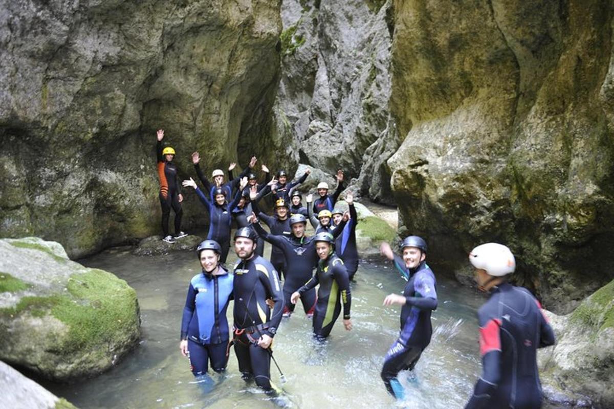 a group of people in the water on a river