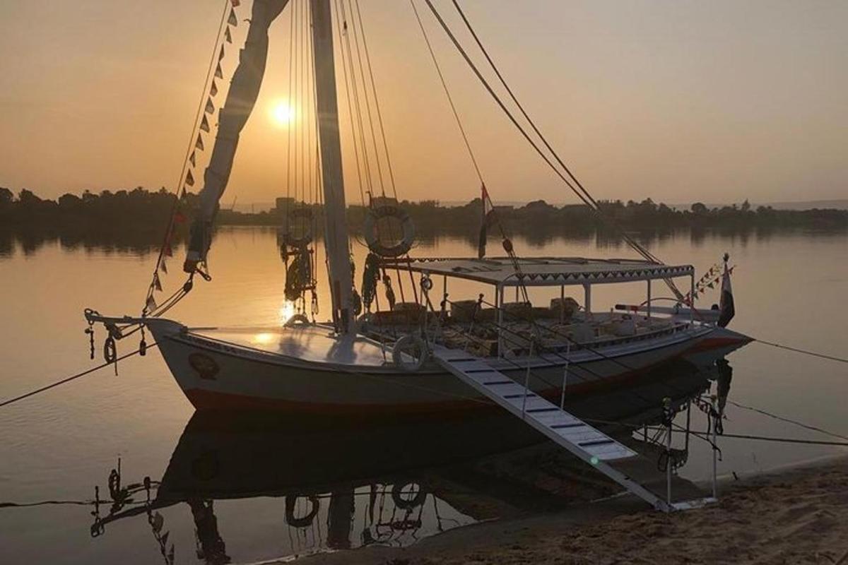 a boat is docked on the water at sunset
