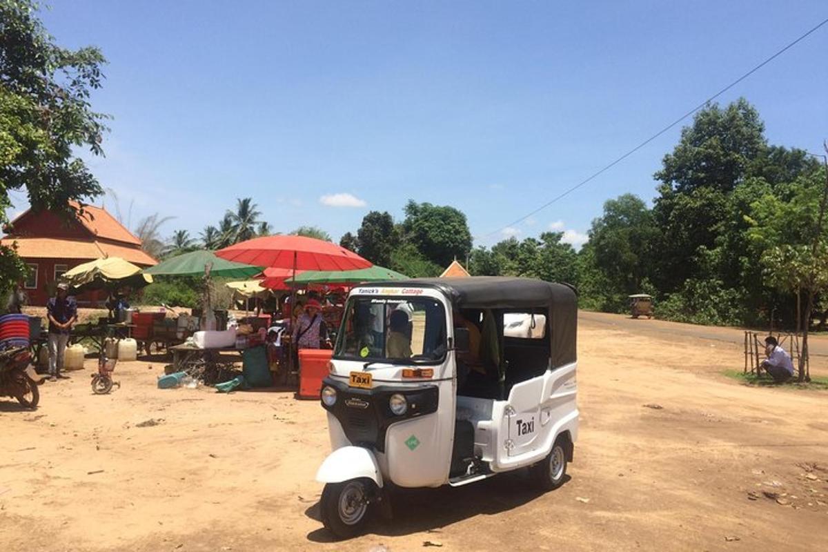 a small golf cart parked in front of a market