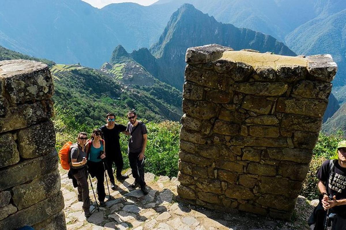a group of people standing at the top of a mountain