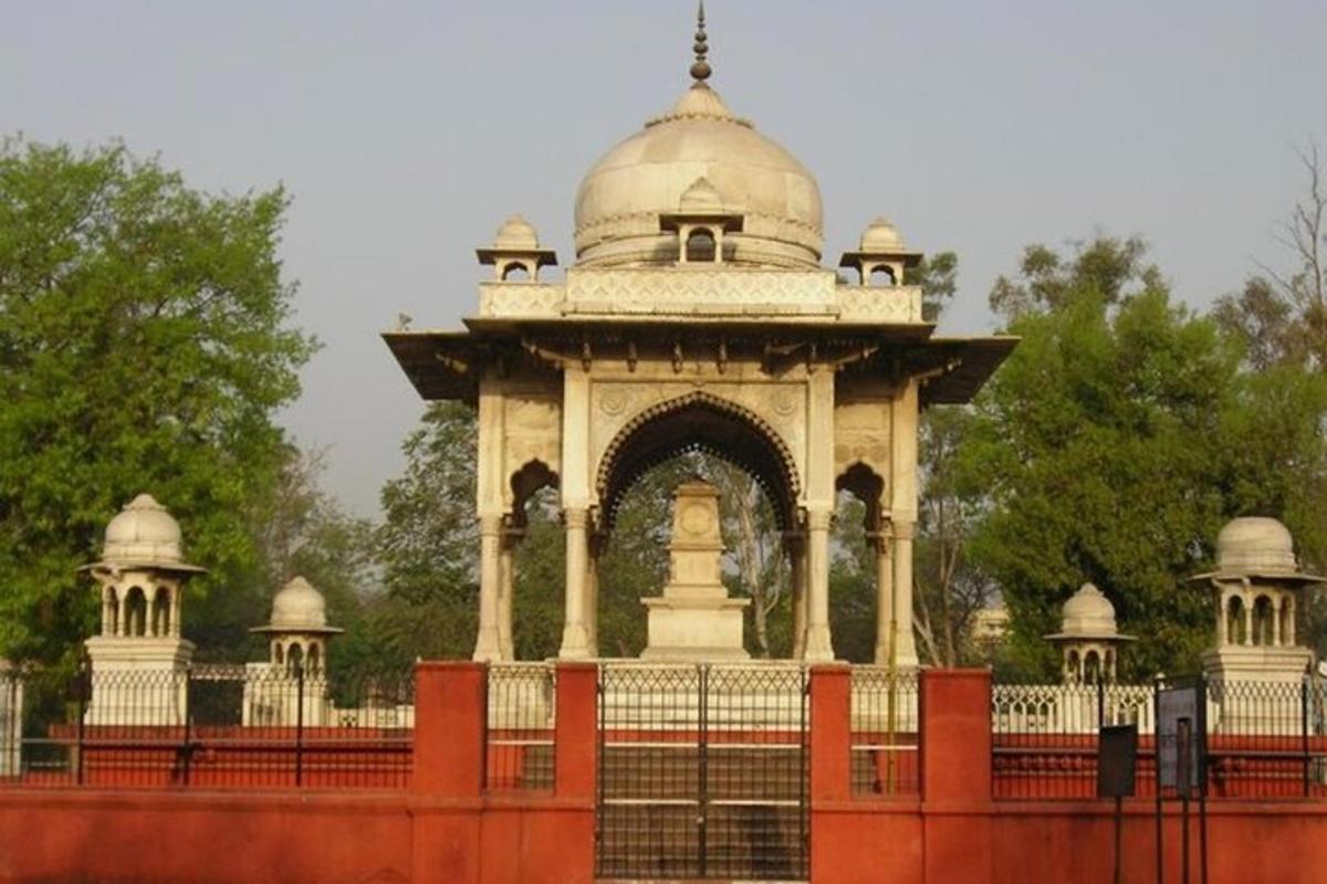 a large building behind a fence with a gate