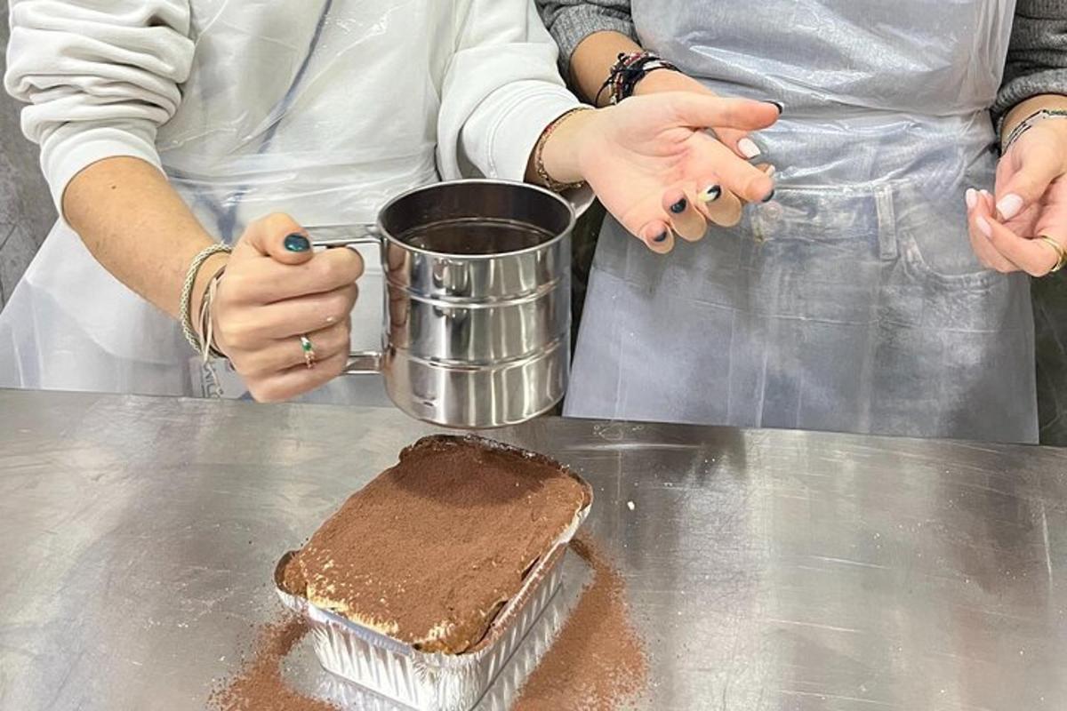 a woman holding a cup and a piece of chocolate cake