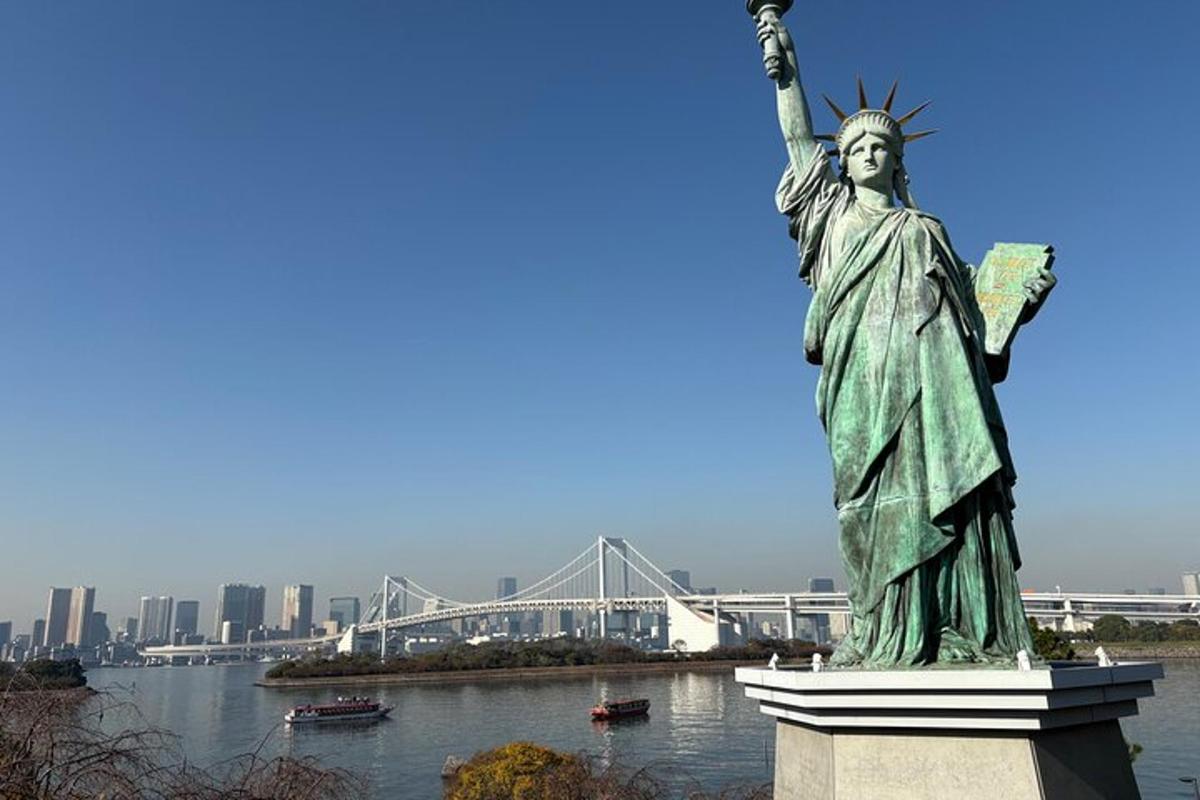 a statue of liberty with a bridge in the background