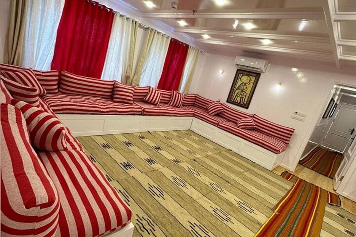 a living room with a large red and white couch