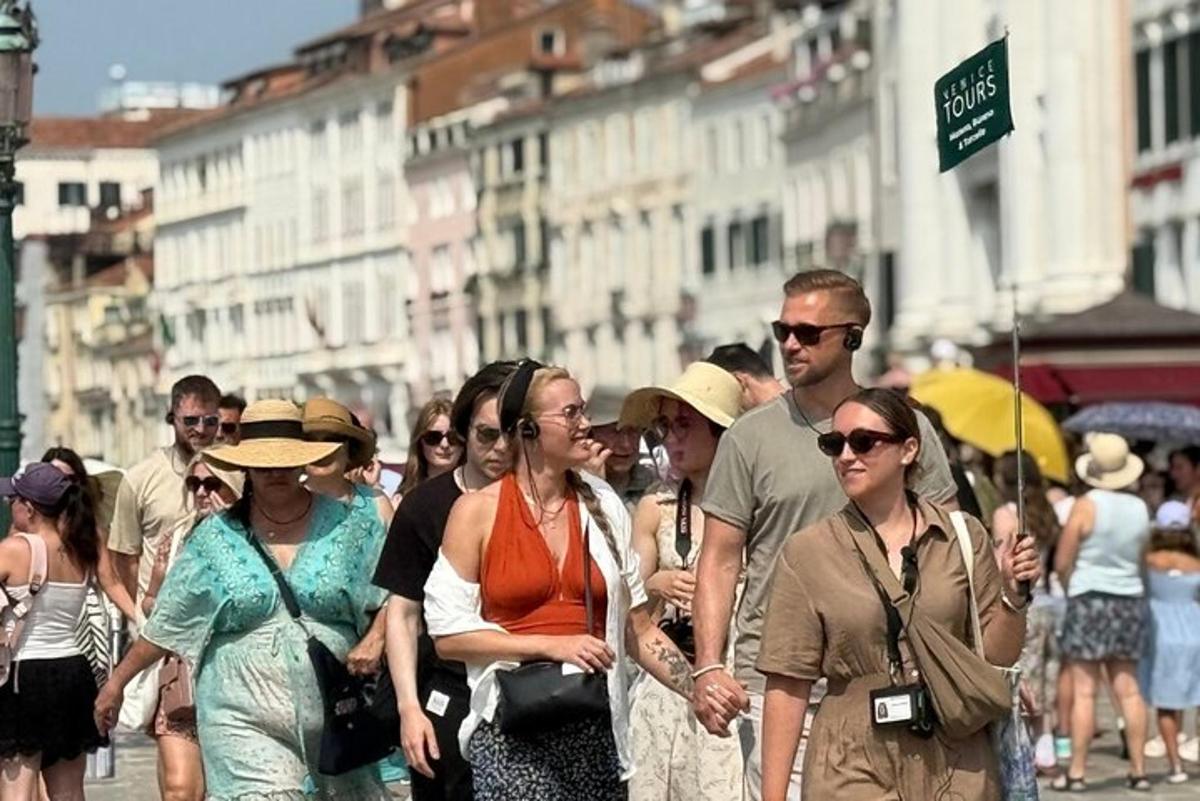 a group of people walking down a city street