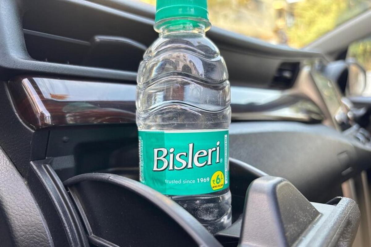 a bottle of water sitting inside of a car
