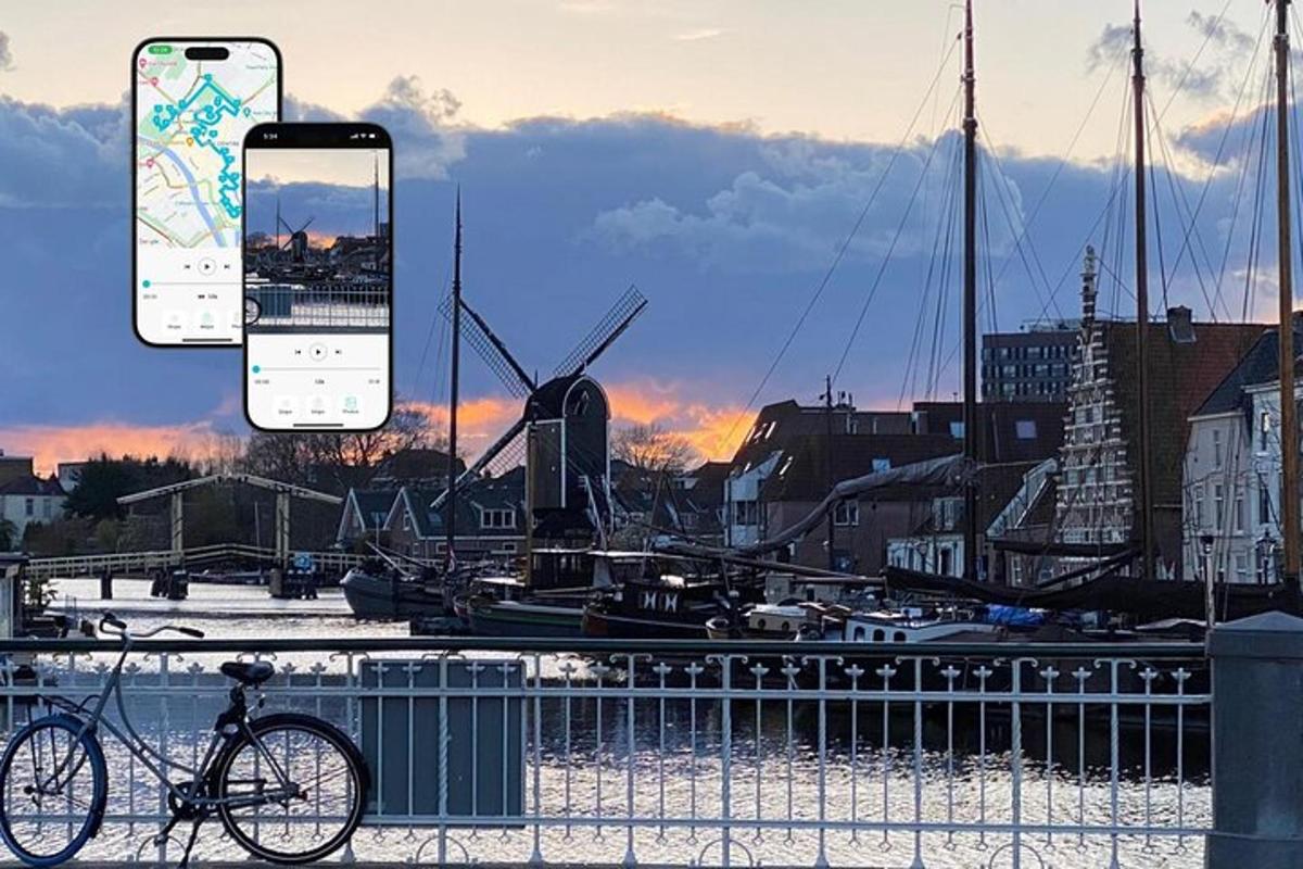 egy kikötő előtt leparkolt bicikli egy mobiltelefonnal