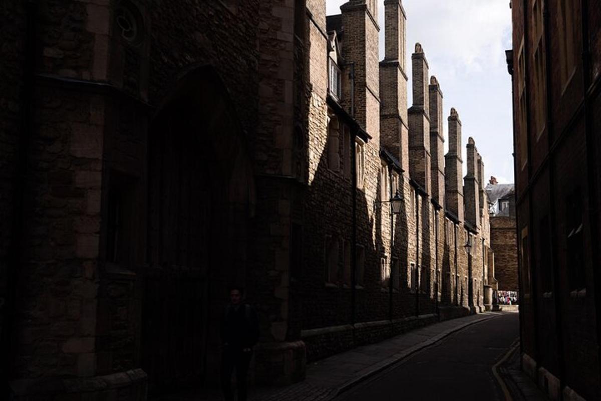 a person walking down an alley in a building