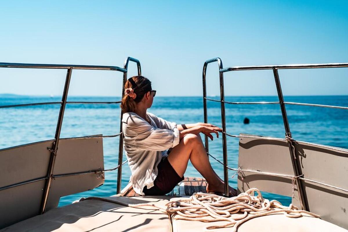 a woman sitting on the back of a boat