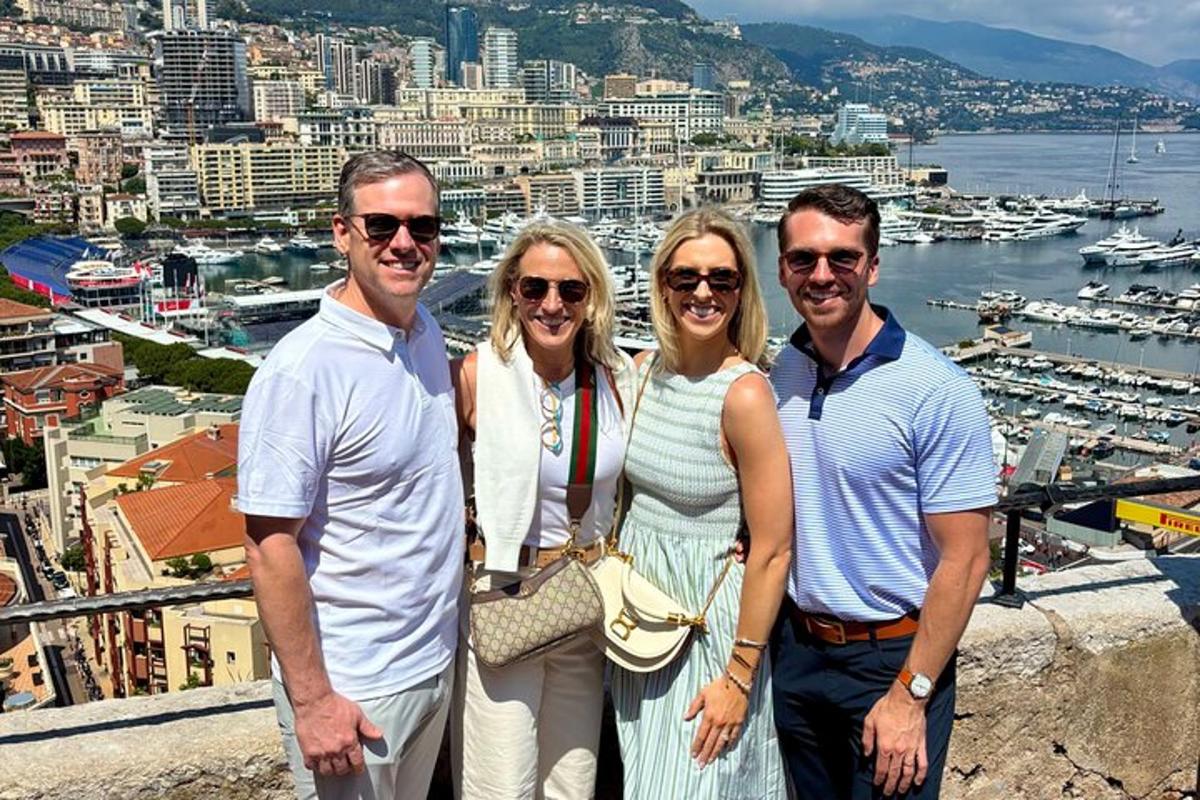a group of people standing on top of a building