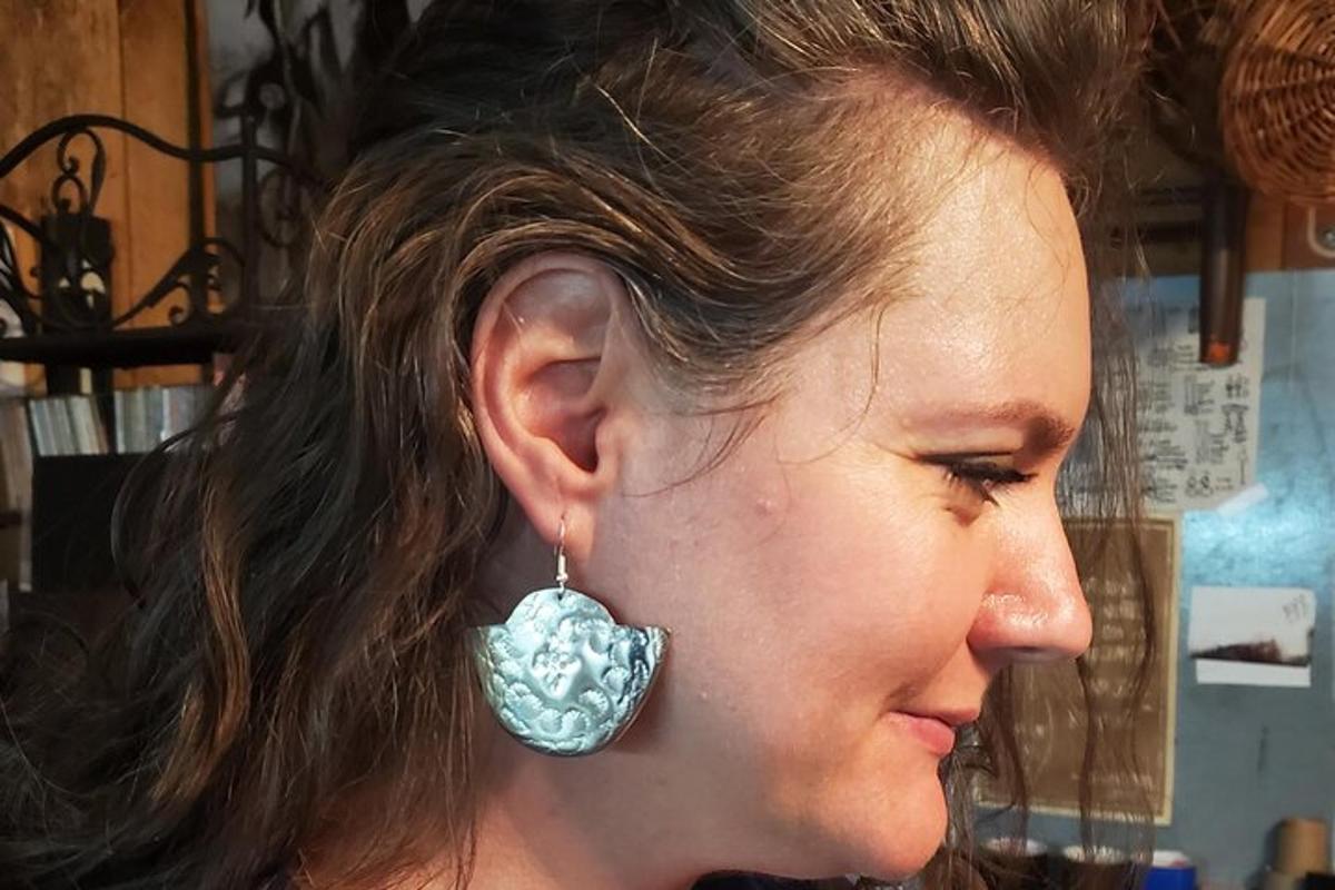 a woman with an earring in her ear