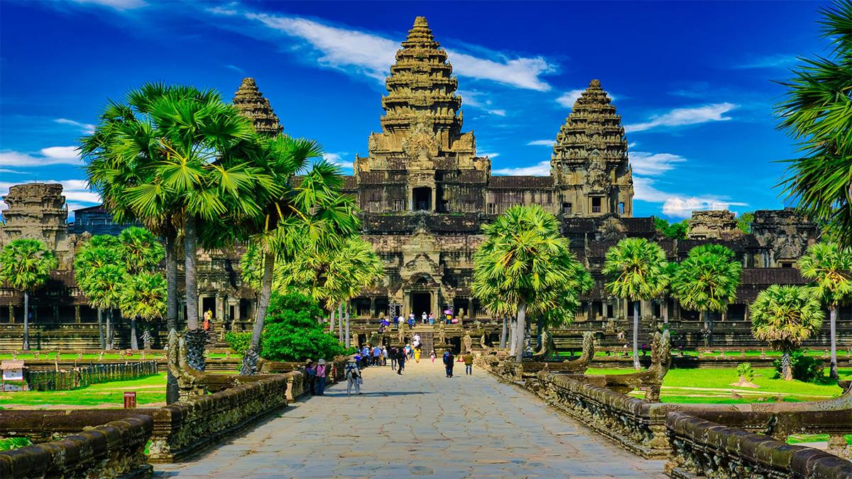 a view of a temple with palm trees
