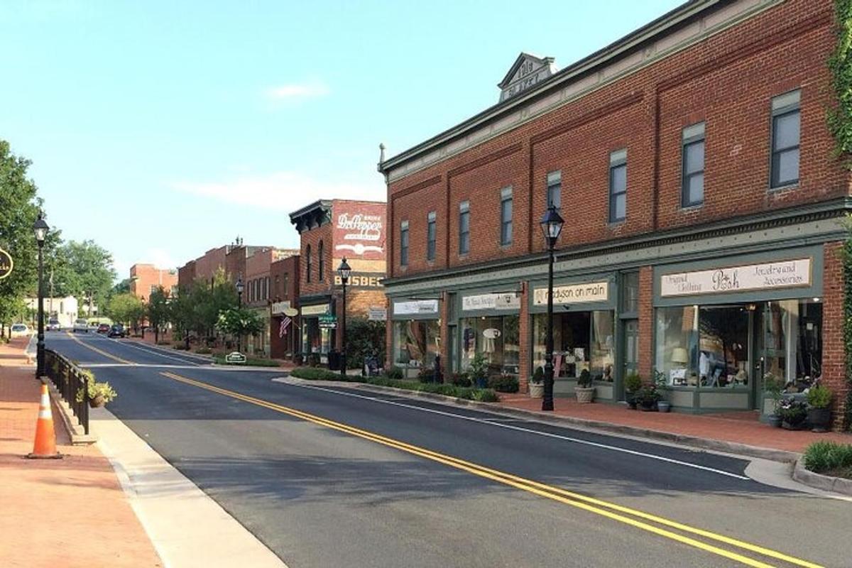 an empty street in a small town with buildings