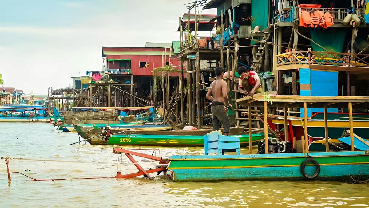 a man standing on a boat in the water