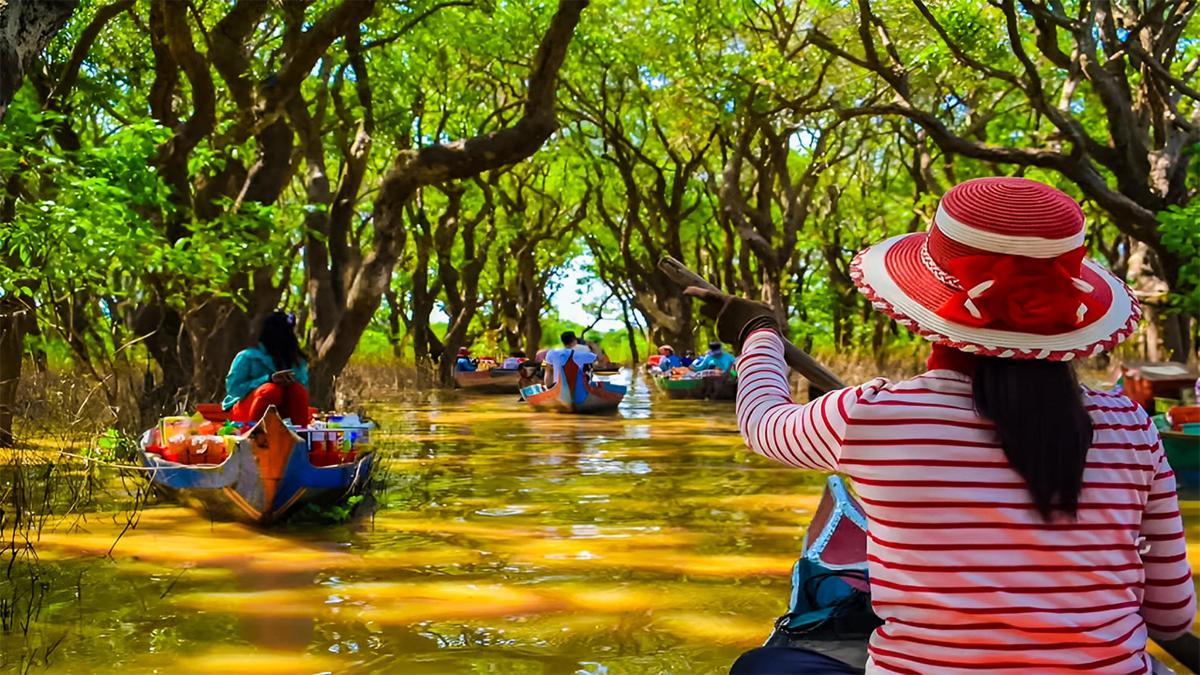 a woman riding on a boat in a river