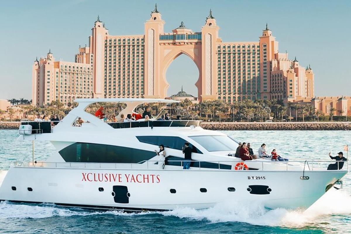 a white boat in the water in front of a city