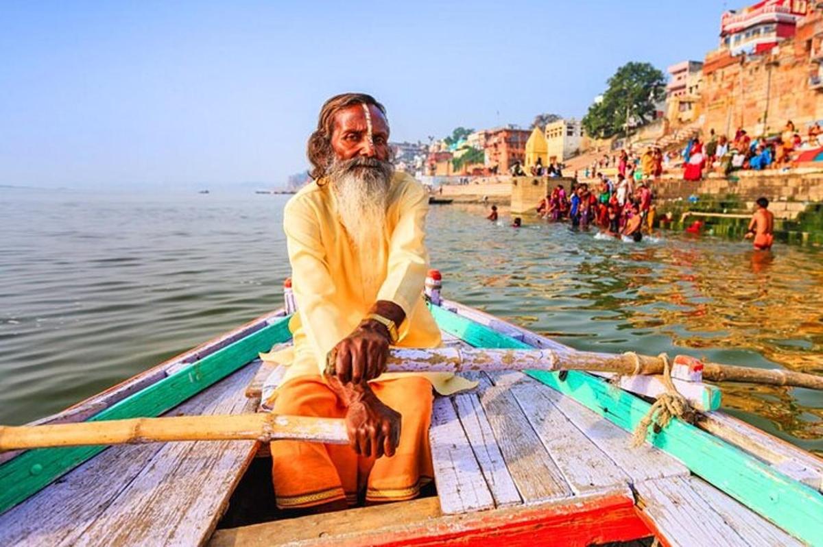 a man sitting on a boat in the water