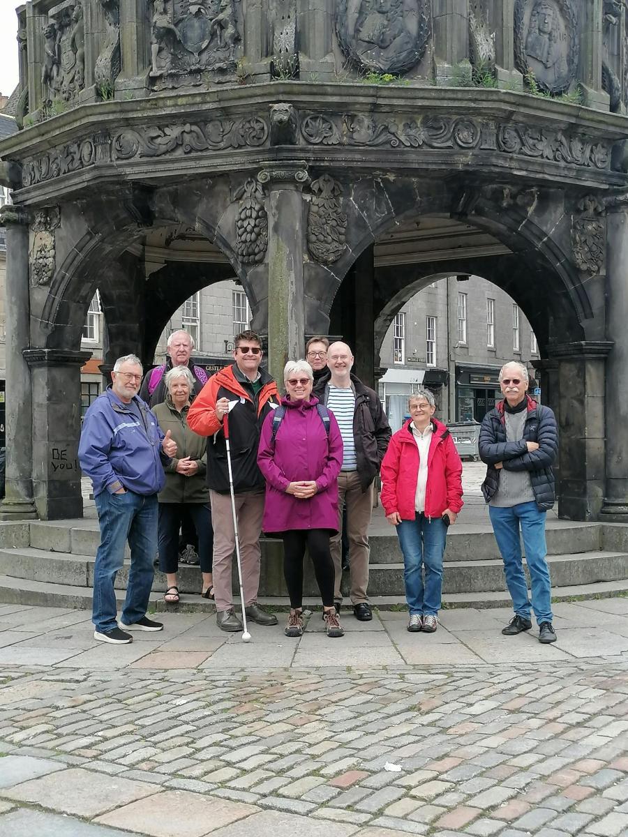 a group of people standing in front of a building
