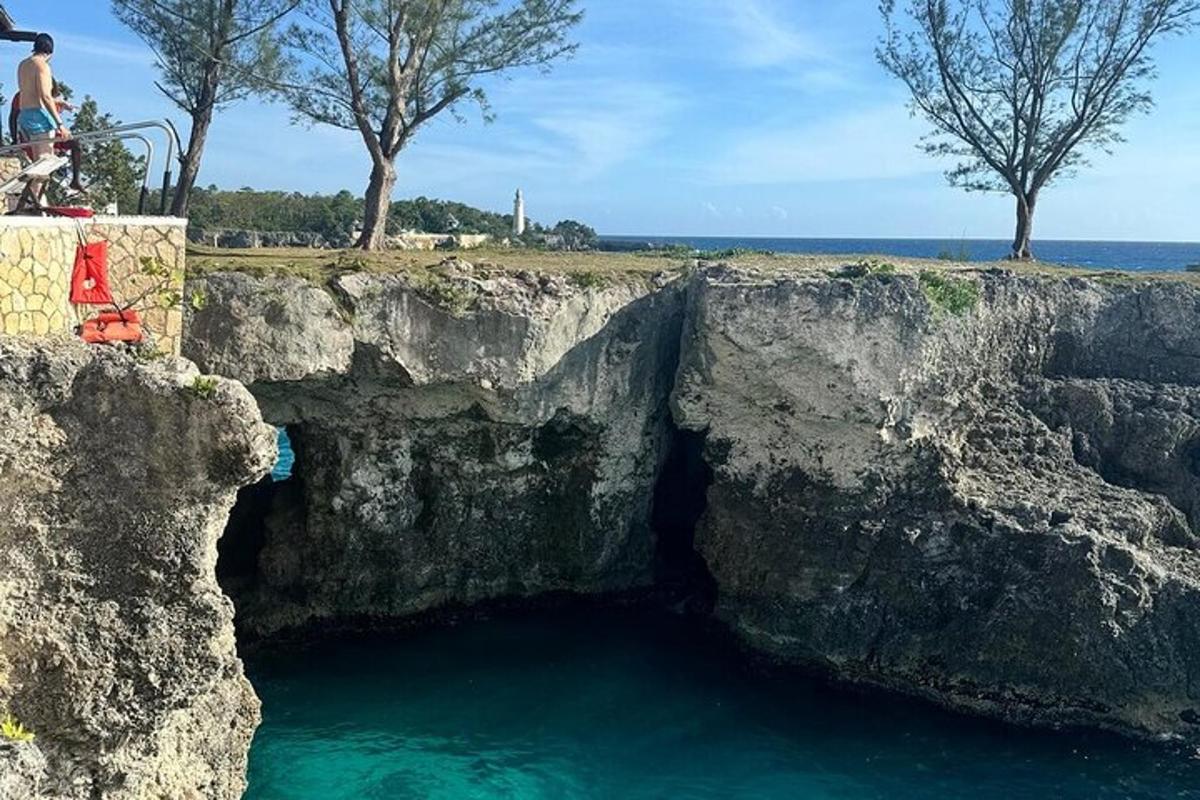a cave in the side of a rocky cliff