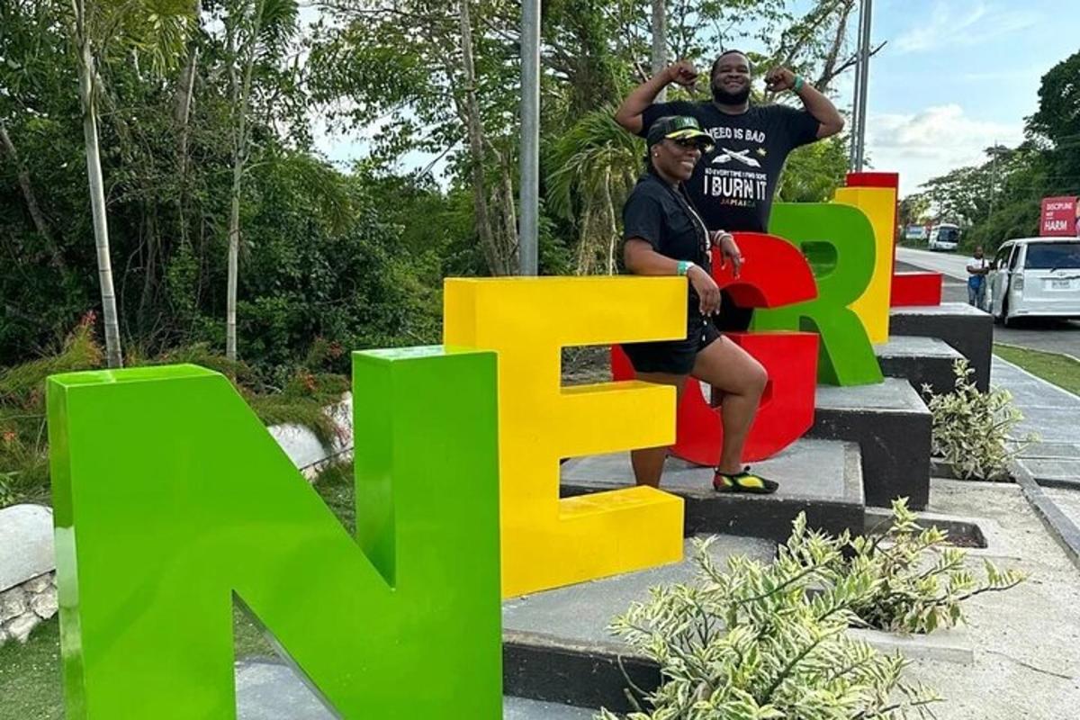 two men sitting on a sign with the word exit