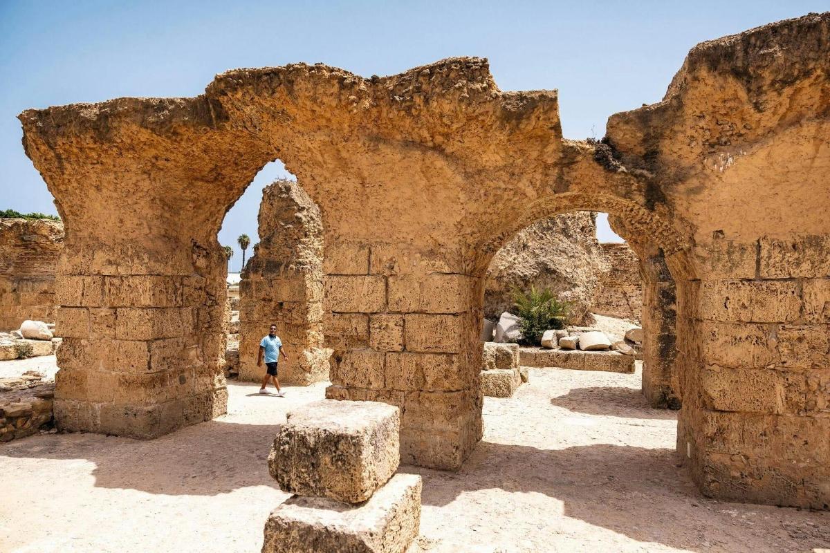 a person walking through an old stone building