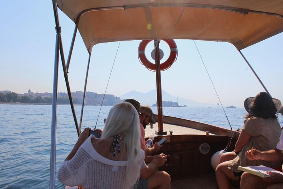 a group of people on a boat in the water