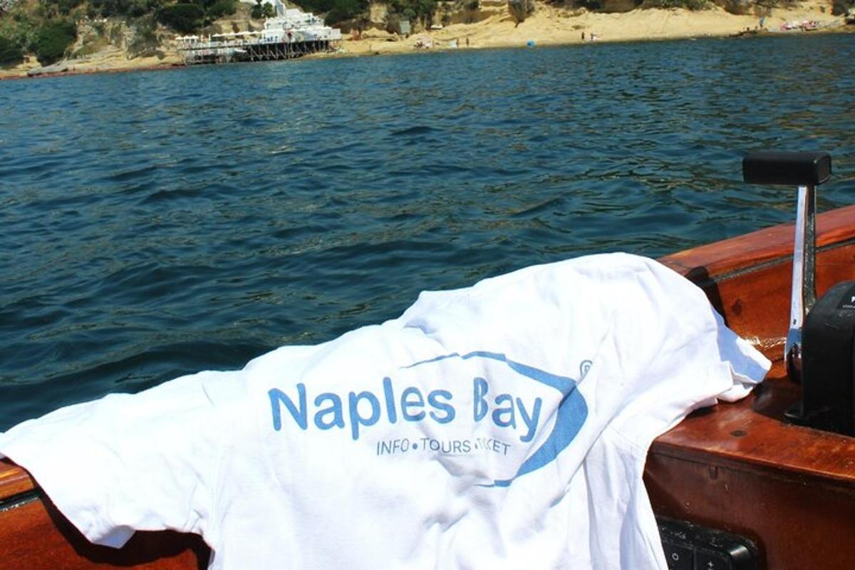 a white shirt sitting on the side of a boat