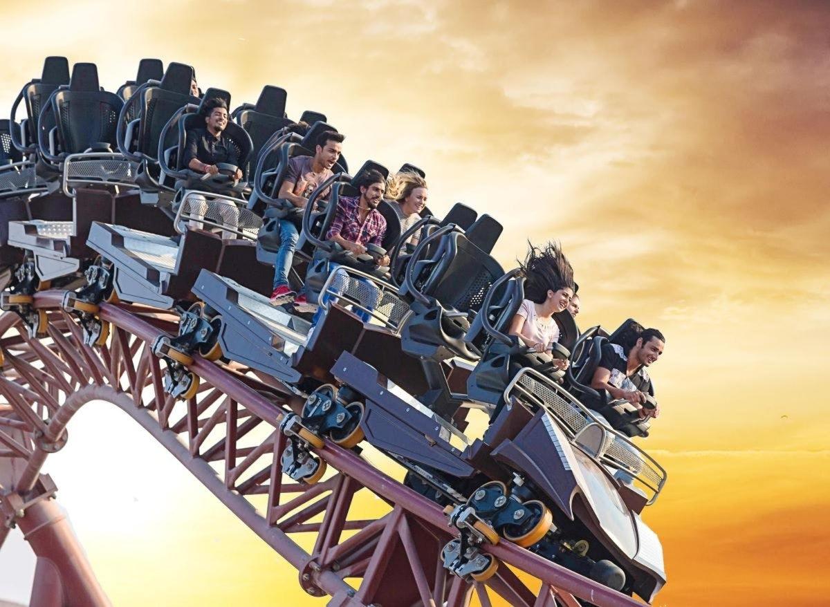 a group of people riding on a roller coaster
