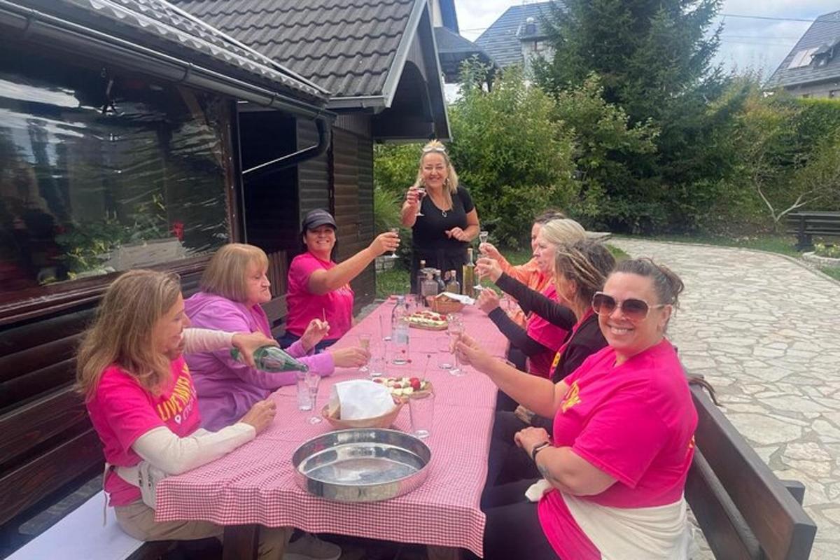 a group of women sitting at a table with wine glasses