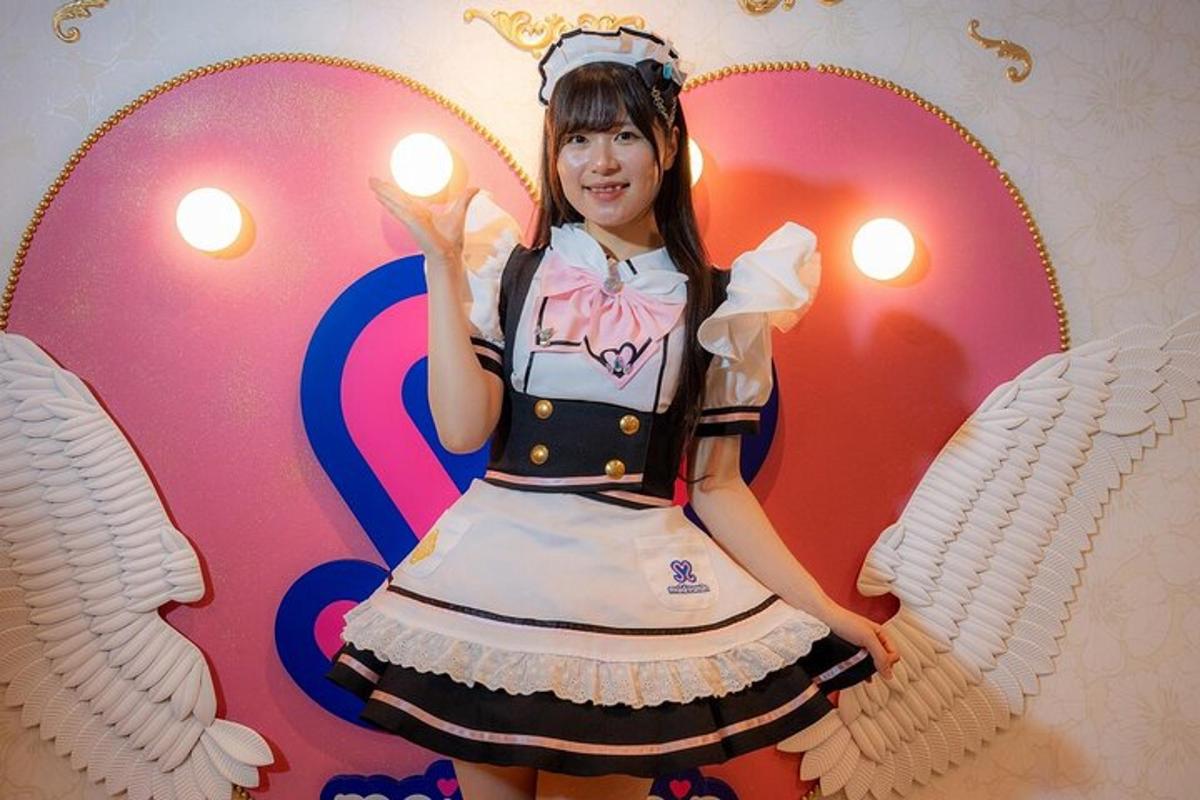 a young girl dressed in a dress with angel wings