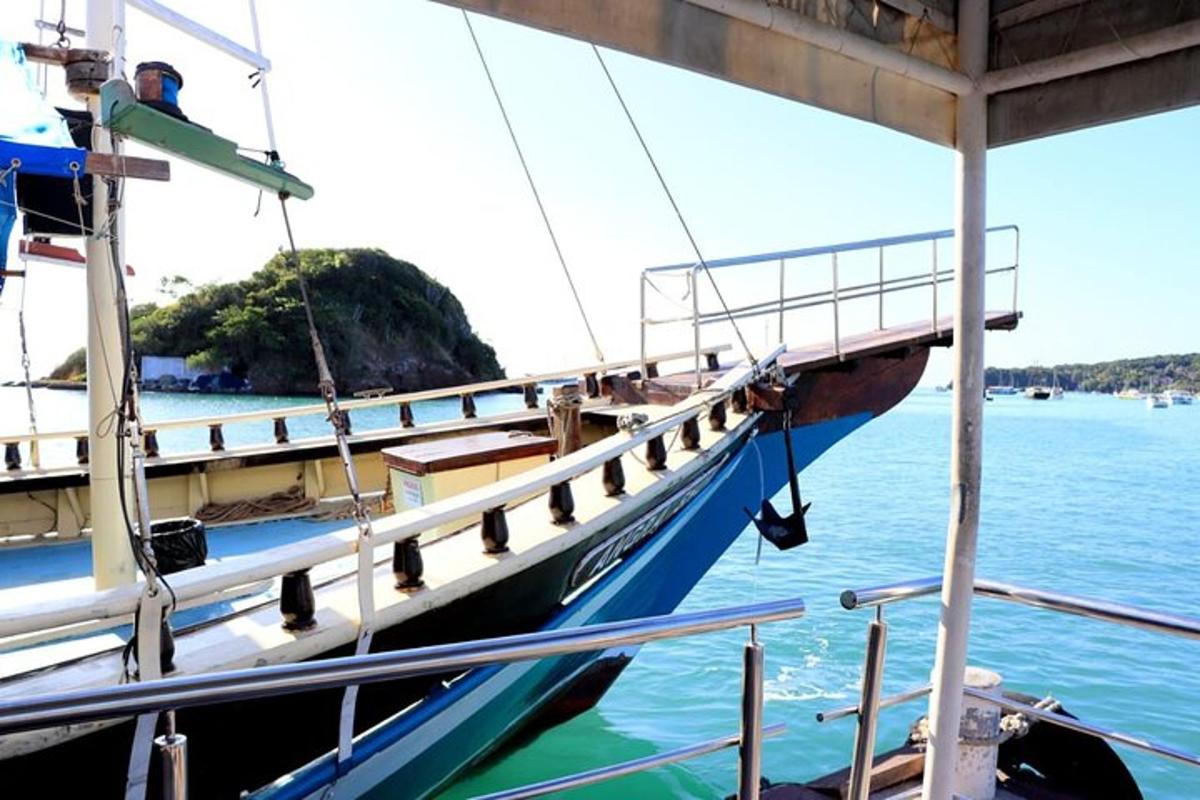 a boat is docked at a dock in the water