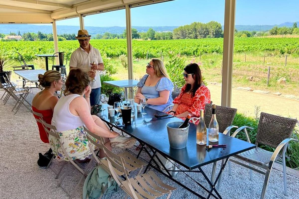 a group of people sitting at a table with wine glasses