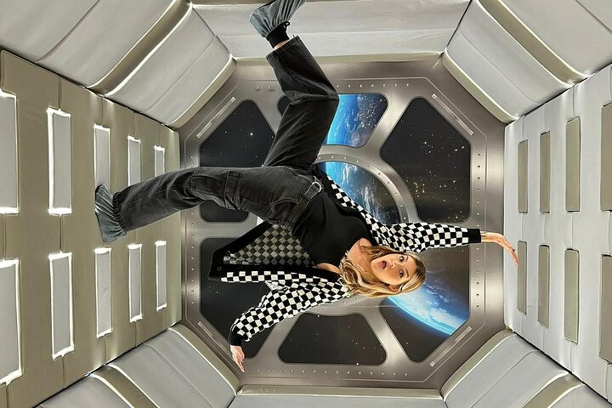 a woman is laying on her back in a cube